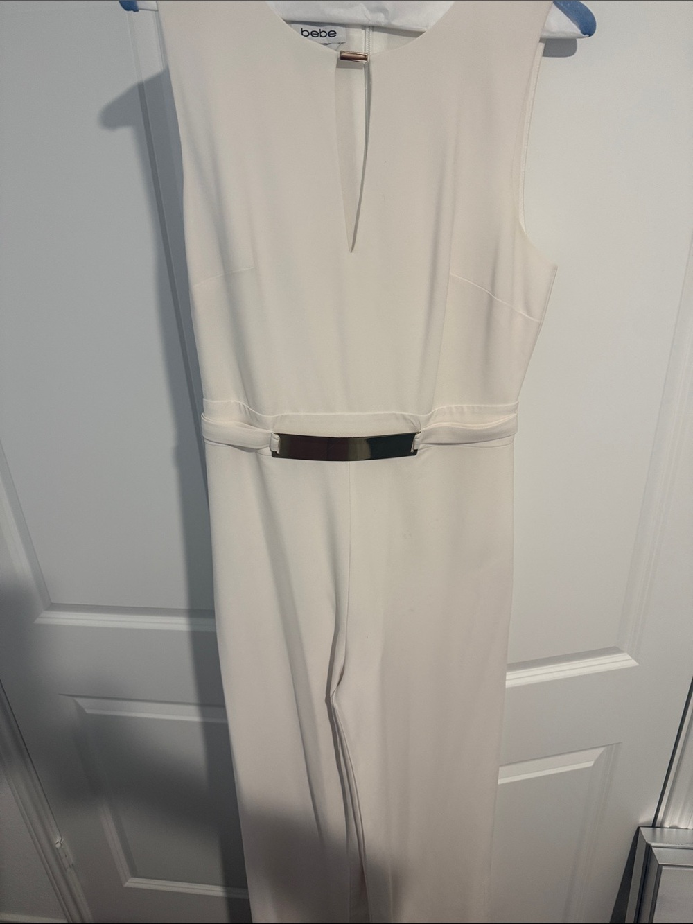 bebe Cream Sleeveless Jumpsuit with Metallic Waist Bar